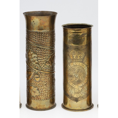 511 - AN INTERESTING COLLECTION OF SEVEN FIRST WORLD WAR TRENCH ART SHELL CASES. A pair of Trench art vase... 