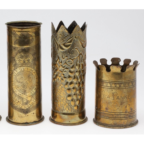 511 - AN INTERESTING COLLECTION OF SEVEN FIRST WORLD WAR TRENCH ART SHELL CASES. A pair of Trench art vase... 