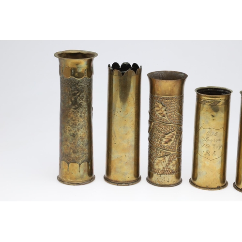 511 - AN INTERESTING COLLECTION OF SEVEN FIRST WORLD WAR TRENCH ART SHELL CASES. A pair of Trench art vase... 