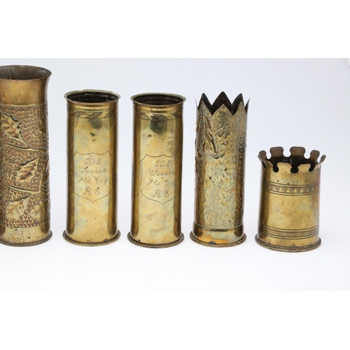 511 - AN INTERESTING COLLECTION OF SEVEN FIRST WORLD WAR TRENCH ART SHELL CASES. A pair of Trench art vase... 