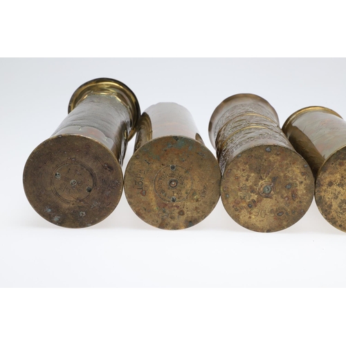 511 - AN INTERESTING COLLECTION OF SEVEN FIRST WORLD WAR TRENCH ART SHELL CASES. A pair of Trench art vase... 