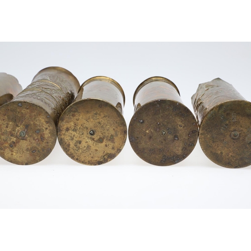 511 - AN INTERESTING COLLECTION OF SEVEN FIRST WORLD WAR TRENCH ART SHELL CASES. A pair of Trench art vase... 