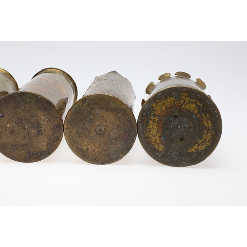 511 - AN INTERESTING COLLECTION OF SEVEN FIRST WORLD WAR TRENCH ART SHELL CASES. A pair of Trench art vase... 