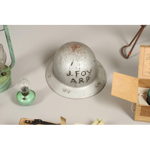 513 - A COLLECTION OF SECOND WORLD WAR HOME FRONT ITEMS TO INCLUDE A.R.P. EQUIPMENT. A collection of Secon... 