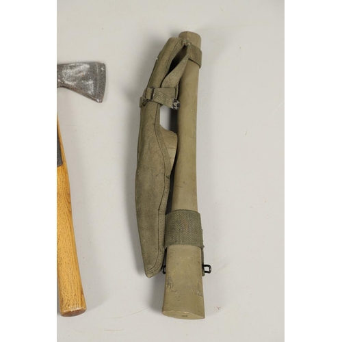 514 - THREE AMERICAN SECOND WORLD WAR MILITARY PICKAXES AND TWO AXES. A U.S. Military webbing mounted pick... 