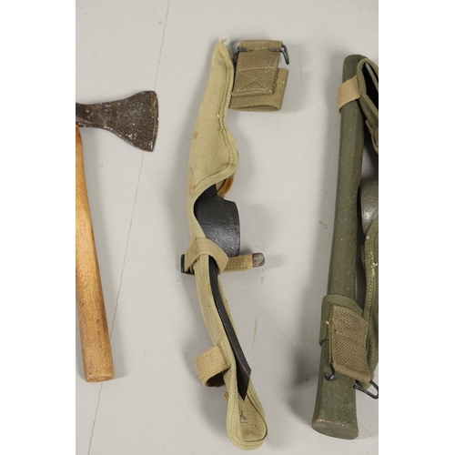 514 - THREE AMERICAN SECOND WORLD WAR MILITARY PICKAXES AND TWO AXES. A U.S. Military webbing mounted pick... 