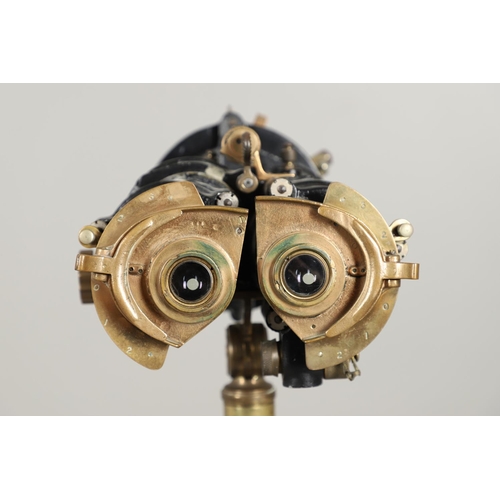 523 - A SECOND WORLD WAR OR LATER MILITARY BINOCULAR TELESCOPE GUNSIGHT ON TRIPOD BASE. A pair of Ross 7 x... 