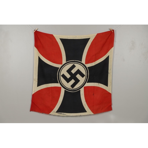 525 - A THIRD REICH WAR VETERANS BANNER OR FLAG. A square printed cotton flag or banner with a swastika ag... 