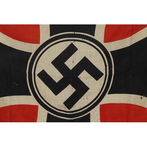 525 - A THIRD REICH WAR VETERANS BANNER OR FLAG. A square printed cotton flag or banner with a swastika ag... 