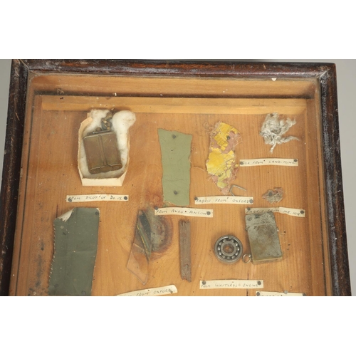 527 - A COLLECTORS CABINET CONTAINING A VARIED AND INTERESTING COLLECTION OF SECOND WORLD WAR ARTEFACTS. A... 