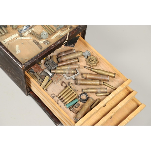 527 - A COLLECTORS CABINET CONTAINING A VARIED AND INTERESTING COLLECTION OF SECOND WORLD WAR ARTEFACTS. A... 