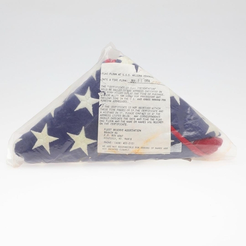 528 - AN AMERICAN MEMORIAL FLAG FLOWN AT THE ARIZONA MEMORIAL. An American 's tars and Stripes' flag folde... 