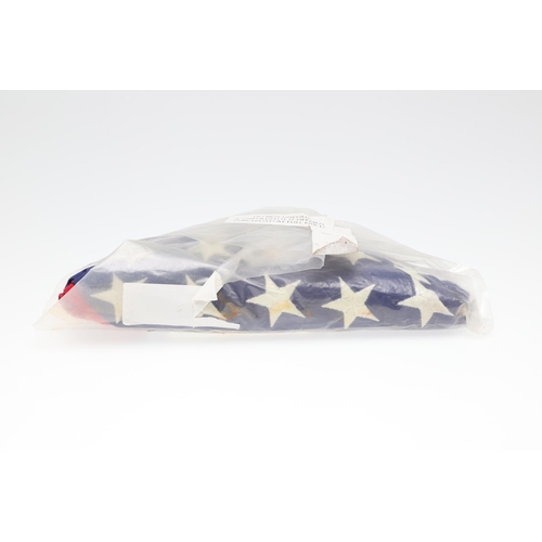 528 - AN AMERICAN MEMORIAL FLAG FLOWN AT THE ARIZONA MEMORIAL. An American 's tars and Stripes' flag folde... 