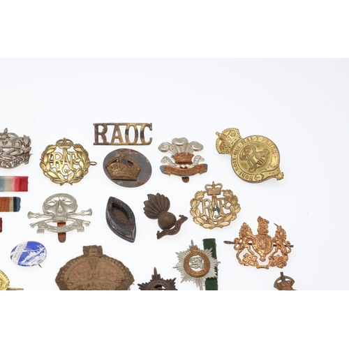 534 - AN INTERESTING COLLECTION OF SECOND WORLD WAR AND OTHER CAP BADGES AND INSIGNIA. A collection of bad... 