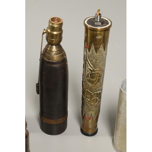 539 - A COLLECTION OF TRENCH ART SHELLS AND LIGHTERS. A collection of trench art to include two similar sh... 