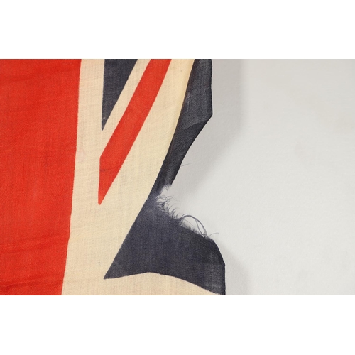 543 - A COLLECTION OF BRITISH FLAGS: TWO UNION JACKS, A RED AND WHITE ENSIGN. A Union Jack of sewn constru... 