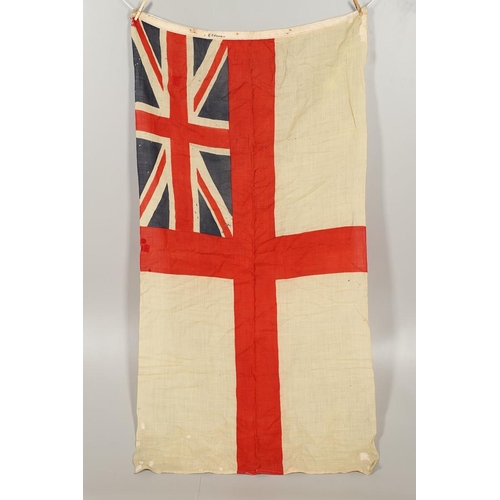 543 - A COLLECTION OF BRITISH FLAGS: TWO UNION JACKS, A RED AND WHITE ENSIGN. A Union Jack of sewn constru... 