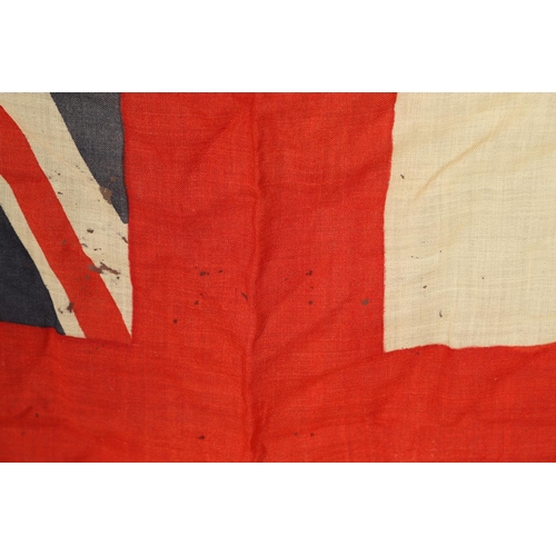 543 - A COLLECTION OF BRITISH FLAGS: TWO UNION JACKS, A RED AND WHITE ENSIGN. A Union Jack of sewn constru... 