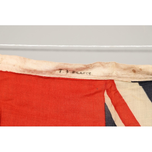 543 - A COLLECTION OF BRITISH FLAGS: TWO UNION JACKS, A RED AND WHITE ENSIGN. A Union Jack of sewn constru... 