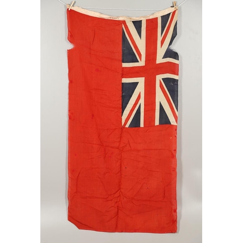 543 - A COLLECTION OF BRITISH FLAGS: TWO UNION JACKS, A RED AND WHITE ENSIGN. A Union Jack of sewn constru... 