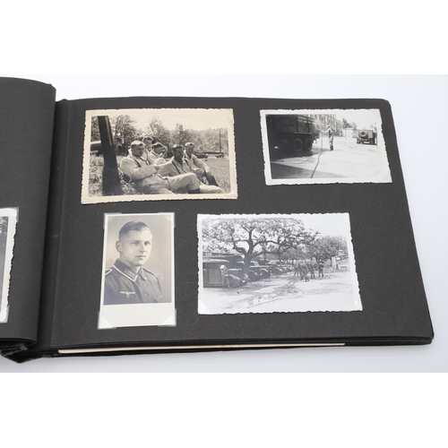 546 - A SECOND WORLD WAR GERMAN 'MEMORIES OF THE WAR' ALBUM AND PHOTOGRAPHS. A photograph album with leath... 