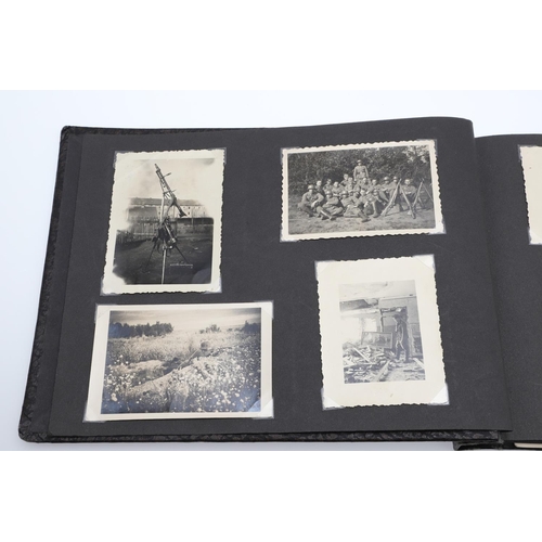 546 - A SECOND WORLD WAR GERMAN 'MEMORIES OF THE WAR' ALBUM AND PHOTOGRAPHS. A photograph album with leath... 