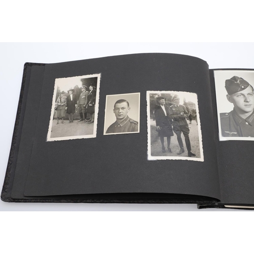 546 - A SECOND WORLD WAR GERMAN 'MEMORIES OF THE WAR' ALBUM AND PHOTOGRAPHS. A photograph album with leath... 