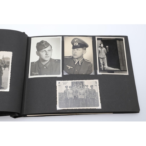 546 - A SECOND WORLD WAR GERMAN 'MEMORIES OF THE WAR' ALBUM AND PHOTOGRAPHS. A photograph album with leath... 