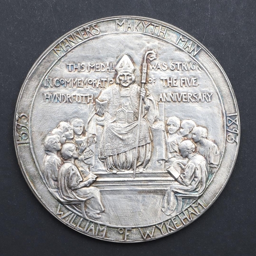 574 - A WINCHESTER COLLEGE QUINCENTENARY MEDAL BY GEORGE FRAMPTON, AND ANOTHER. A large silvered presentat... 