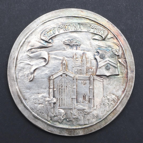 574 - A WINCHESTER COLLEGE QUINCENTENARY MEDAL BY GEORGE FRAMPTON, AND ANOTHER. A large silvered presentat... 