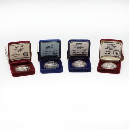 582 - A COLLECTION OF FOUR SILVER AVIATION RELATED COMMEMORATIVE MEDALS. A fine silver one troy ounce meda... 