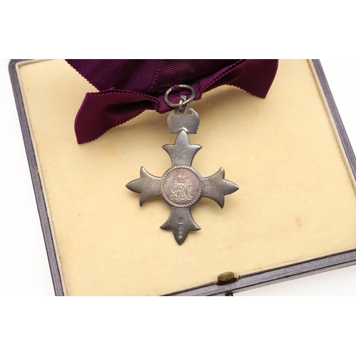 629 - A GEORGE V M.B.E. LADIES AWARD. An MBE on first type civilian ribbon, hallmarked for London 1918, Ga... 