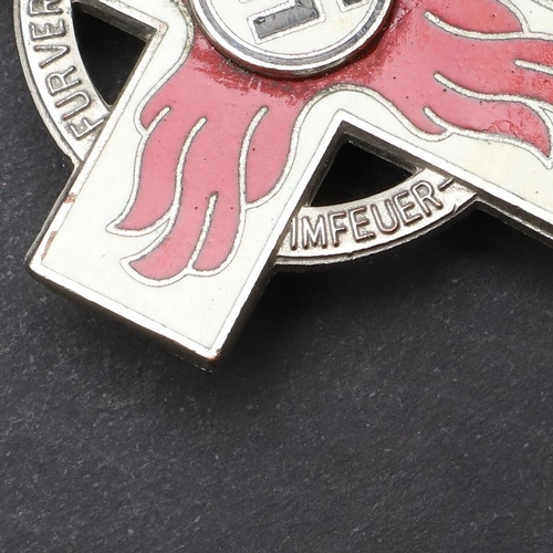 632 - A SECOND WORLD WAR GERMAN FIRE SERVICE CROSS, 1ST CLASS. A fire service cross in white metal with re... 