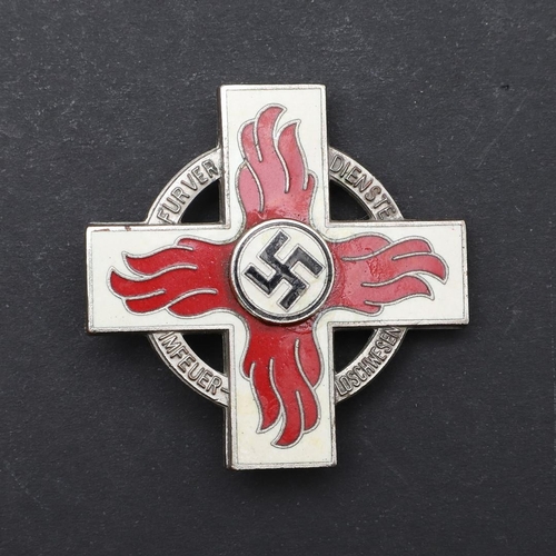 632 - A SECOND WORLD WAR GERMAN FIRE SERVICE CROSS, 1ST CLASS. A fire service cross in white metal with re... 