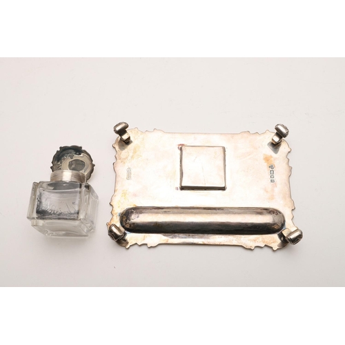 100 - TWO EARLY 20TH CENTURY SILVER INKSTANDS. one rectangular, with rounded corners, a reeded border and ... 