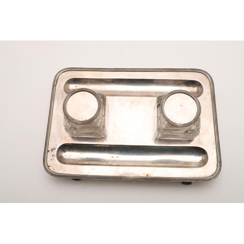 100 - TWO EARLY 20TH CENTURY SILVER INKSTANDS. one rectangular, with rounded corners, a reeded border and ... 