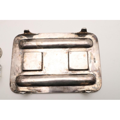 100 - TWO EARLY 20TH CENTURY SILVER INKSTANDS. one rectangular, with rounded corners, a reeded border and ... 