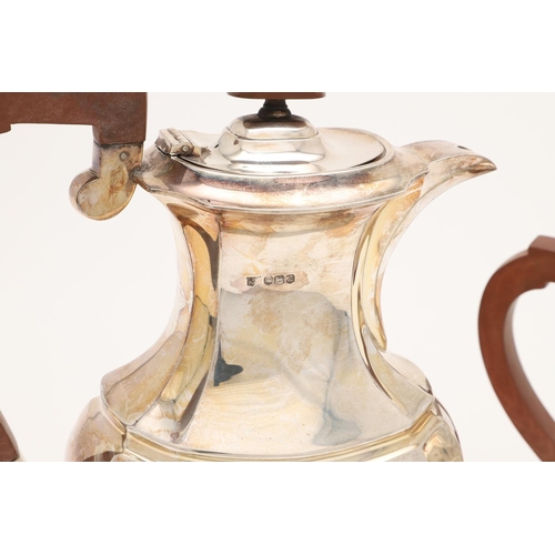 102 - AN ELIZABETH II SILVER TEA POT & MATCHING HOT WATER JUG. of shaped oblong form, with angular handles... 