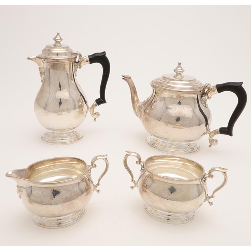 110 - A GEORGE VI FOUR-PIECE SILVER TEA SET. with oval baluster bodies, spreading oval feet & the hot wate... 