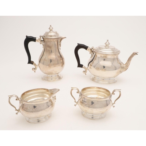 110 - A GEORGE VI FOUR-PIECE SILVER TEA SET. with oval baluster bodies, spreading oval feet & the hot wate... 