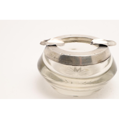 111 - SILVER ASHTRAYS:-. five silver ashtrays (one inscribed & one with an emblem) and a glass mounted ash... 