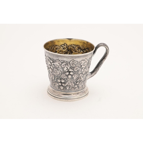 118 - A VICTORIAN SILVER MUG. tapering circular form, with a naturalistic handle and  embossed with fruiti... 