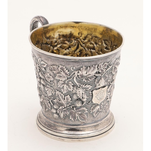 118 - A VICTORIAN SILVER MUG. tapering circular form, with a naturalistic handle and  embossed with fruiti... 