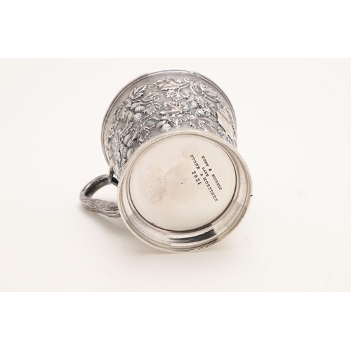 118 - A VICTORIAN SILVER MUG. tapering circular form, with a naturalistic handle and  embossed with fruiti... 