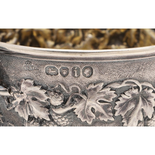 118 - A VICTORIAN SILVER MUG. tapering circular form, with a naturalistic handle and  embossed with fruiti... 