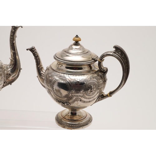 119 - A VICTORIAN FOUR-PIECE SILVER TEA & COFFEE SERVICE. of circular bellied form, with embossed, chased ... 