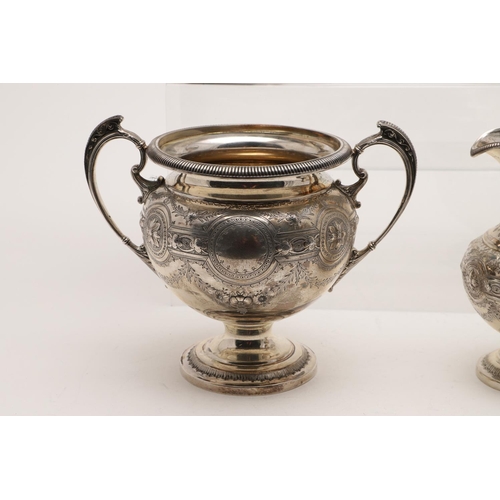 119 - A VICTORIAN FOUR-PIECE SILVER TEA & COFFEE SERVICE. of circular bellied form, with embossed, chased ... 