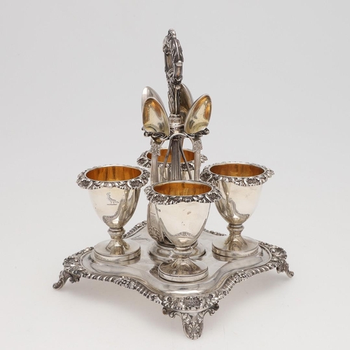 120 - A WILLIAM IV SILVER FOUR EGG-CUP CRUET FRAME. shaped square outline, with a central loop handle and ... 