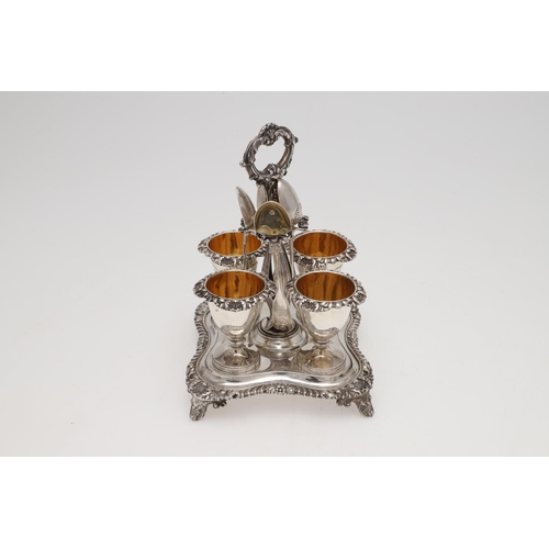 120 - A WILLIAM IV SILVER FOUR EGG-CUP CRUET FRAME. shaped square outline, with a central loop handle and ... 