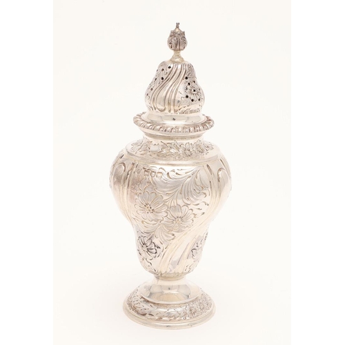 123 - AN EDWARDIAN SILVER SUGAR CASTER. vase-shaped, with a pull-off cover and embossed & chased decoratio... 